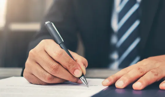 writing on paper with a pen